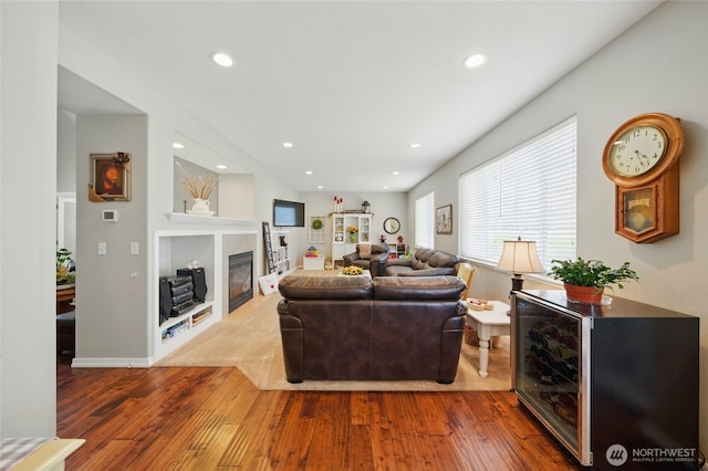 919 Carmella St, Walla Walla, WA 99362 - living area featuring hardwood / wood-style flooring, recessed lighting, and a glass covered fireplace