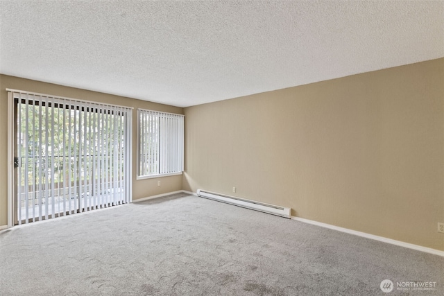 750 N 143rd St Unit 211, Seattle, WA 98133 - empty room featuring a baseboard radiator, carpet flooring, baseboards, and a textured ceiling