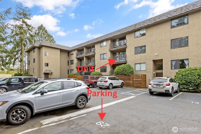 750 N 143rd St Unit 211, Seattle, WA 98133 - view of apartment building / complex with uncovered parking