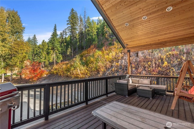 11175 Wending Ln, Leavenworth, WA 98826 - wooden terrace featuring an outdoor hangout area and a wooded view