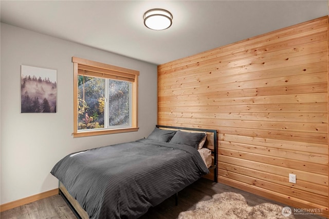 11175 Wending Ln, Leavenworth, WA 98826 - bedroom with wood finished floors, baseboards, and wood walls