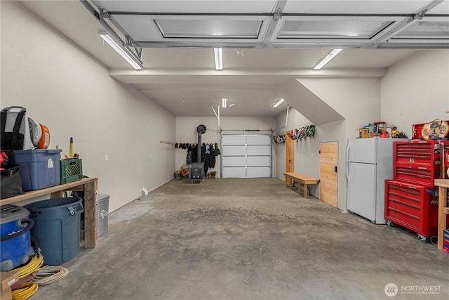 11175 Wending Ln, Leavenworth, WA 98826 - garage featuring freestanding refrigerator