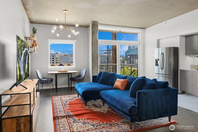 501 Roy St Unit T308, Seattle, WA 98109 - living area with a chandelier and concrete floors