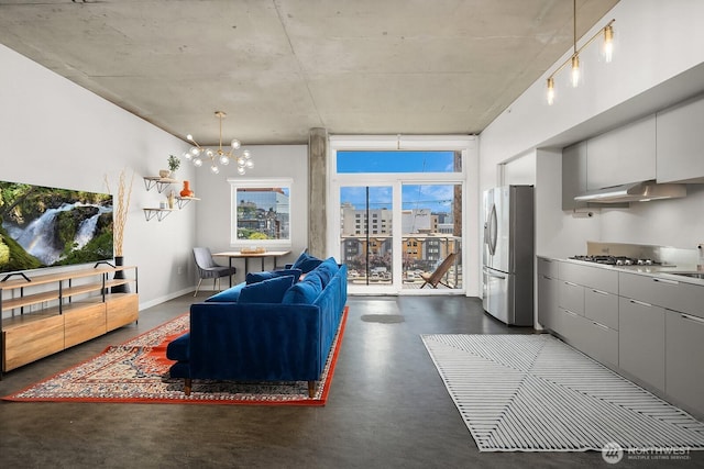501 Roy St Unit T308, Seattle, WA 98109 - living area featuring finished concrete floors and a chandelier