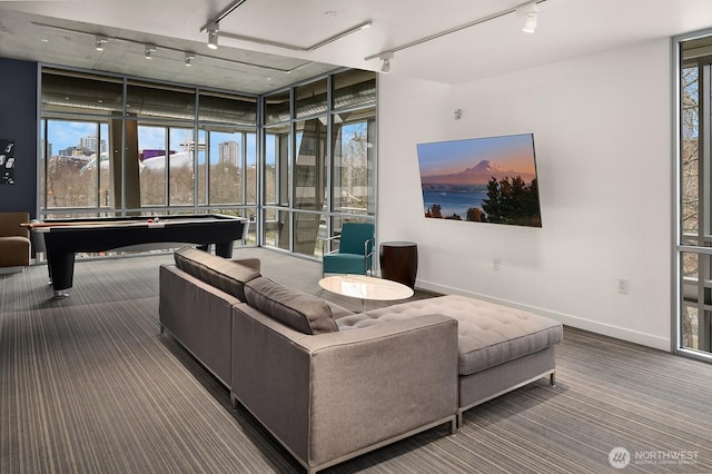 501 Roy St Unit T308, Seattle, WA 98109 - living area with track lighting, billiards, carpet floors, baseboards, and floor to ceiling windows