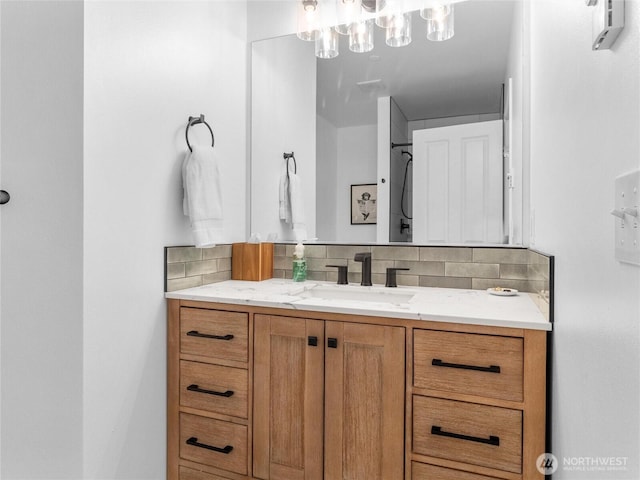 7600 Brianna Ct SE, Olympia, WA 98513 - bathroom featuring vanity and tasteful backsplash