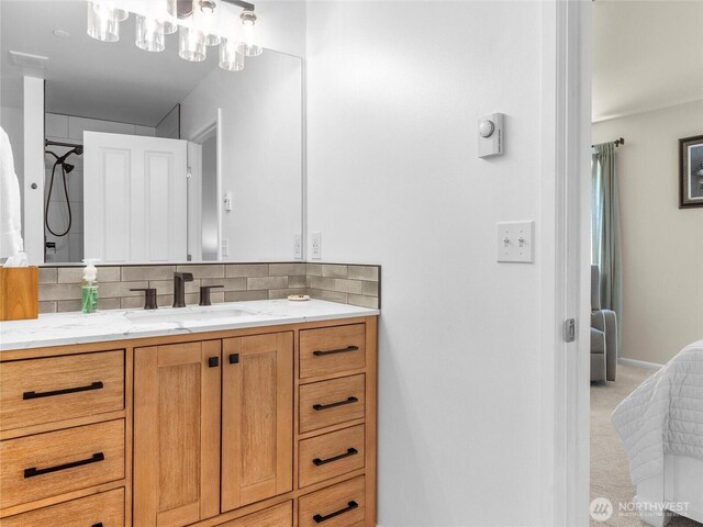 7600 Brianna Ct SE, Olympia, WA 98513 - bathroom featuring vanity and backsplash