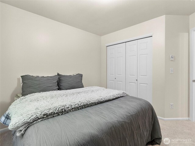 7600 Brianna Ct SE, Olympia, WA 98513 - bedroom featuring light colored carpet, baseboards, and a closet