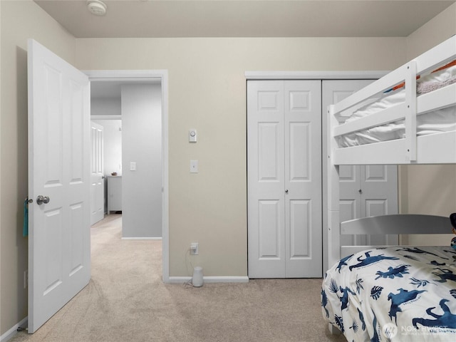 7600 Brianna Ct SE, Olympia, WA 98513 - bedroom with light colored carpet, a closet, and baseboards