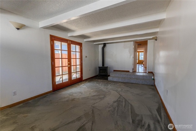1035 Oakes Ave, Everett, WA 98201 - unfurnished room featuring french doors, carpet, a textured ceiling, baseboards, and beamed ceiling