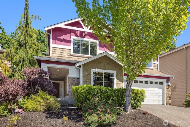 16148 Parkside Way SE, Renton, WA 98058 - view of front facade featuring concrete driveway, stone siding, and a garage