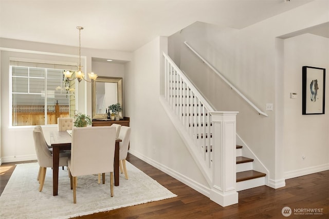 16148 Parkside Way SE, Renton, WA 98058 - dining space featuring dark wood-style floors, baseboards, stairs, and a chandelier