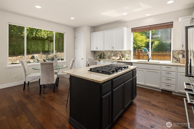 16148 Parkside Way SE, Renton, WA 98058 - kitchen featuring black gas cooktop, a sink, decorative backsplash, white cabinets, and recessed lighting