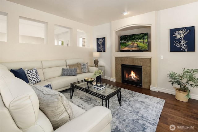16148 Parkside Way SE, Renton, WA 98058 - living area featuring wood finished floors, a tiled fireplace, and baseboards
