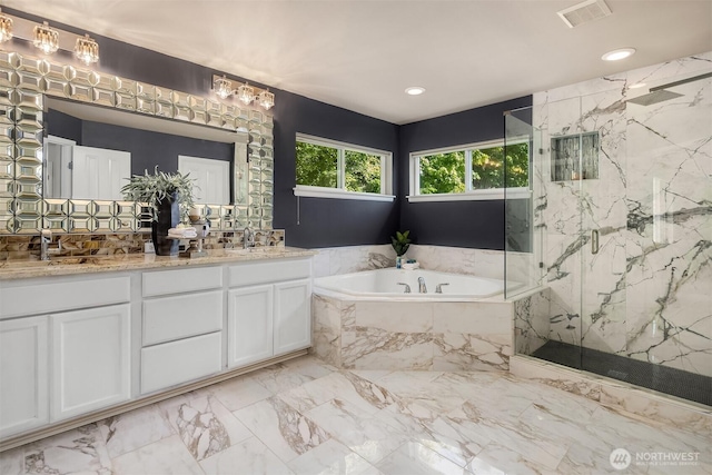 16148 Parkside Way SE, Renton, WA 98058 - bathroom featuring a bath, a marble finish shower, double vanity, marble finish floors, and recessed lighting