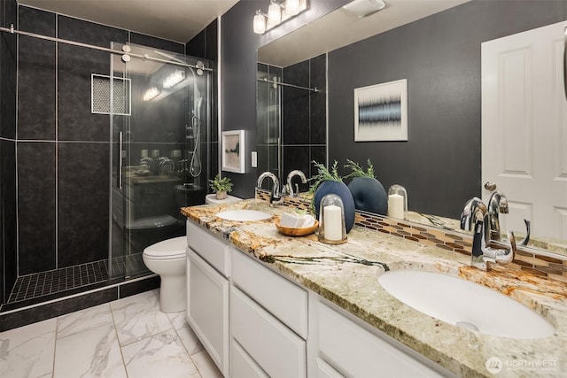 16148 Parkside Way SE, Renton, WA 98058 - bathroom featuring double vanity, toilet, a shower stall, and marble look tiles