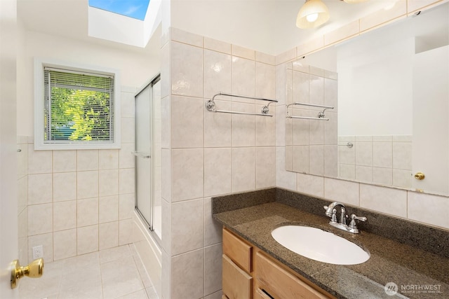 6207 182nd St SW, Lynnwood, WA 98037 - full bathroom featuring tile walls, vanity, and tile patterned floors
