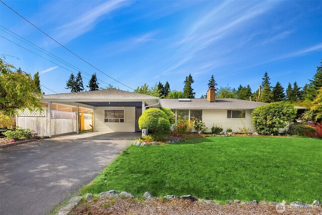 6207 182nd St SW, Lynnwood, WA 98037 - ranch-style home with asphalt driveway, an attached carport, and a chimney
