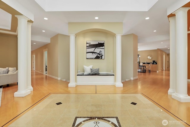 18737 63rd Ave NE, Kenmore, WA 98028 - corridor featuring ornate columns, recessed lighting, inlaid floor details, wood finished floors, and baseboards