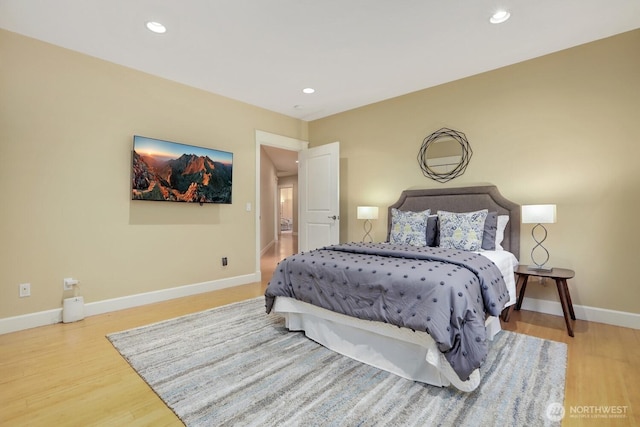 18737 63rd Ave NE, Kenmore, WA 98028 - bedroom with wood finished floors, baseboards, and recessed lighting