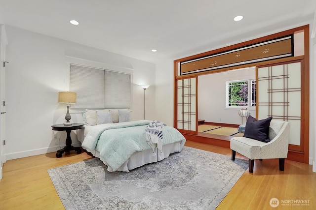 18737 63rd Ave NE, Kenmore, WA 98028 - bedroom with baseboards, wood finished floors, and recessed lighting