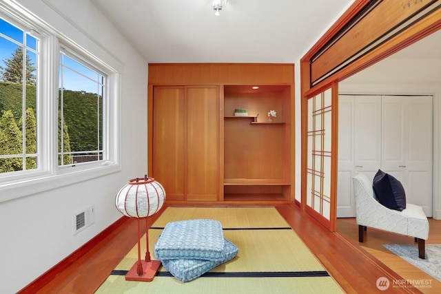18737 63rd Ave NE, Kenmore, WA 98028 - sitting room with healthy amount of natural light, wood finished floors, and baseboards