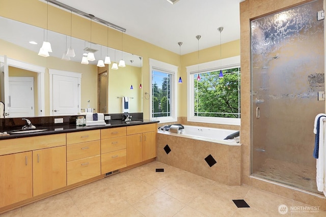 18737 63rd Ave NE, Kenmore, WA 98028 - full bathroom featuring double vanity, a shower stall, a bath, and tile patterned flooring