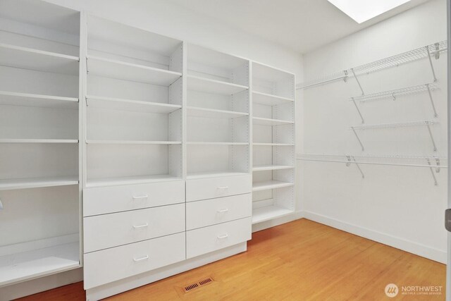 18737 63rd Ave NE, Kenmore, WA 98028 - walk in closet featuring light wood-style flooring