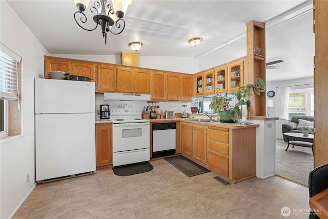 41515 Larson Dr, Gold Bar, WA 98251 - kitchen with white appliances, under cabinet range hood, light countertops, and glass insert cabinets