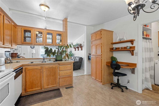 41515 Larson Dr, Gold Bar, WA 98251 - kitchen featuring white appliances, brown cabinets, light countertops, glass insert cabinets, and a peninsula