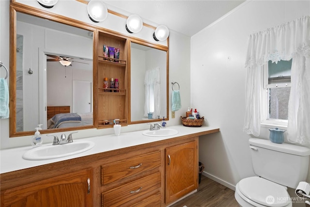 41515 Larson Dr, Gold Bar, WA 98251 - ensuite bathroom with double vanity, wood finished floors, and ceiling fan