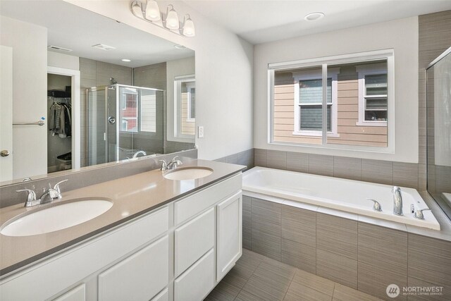 458 SW 111th Pl, Seattle, WA 98146 - full bath featuring healthy amount of natural light, double vanity, a garden tub, and a stall shower