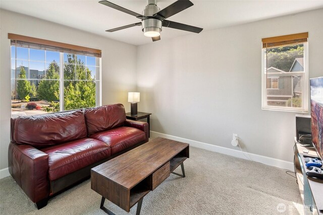 458 SW 111th Pl, Seattle, WA 98146 - living area featuring baseboards, a ceiling fan, and carpet floors