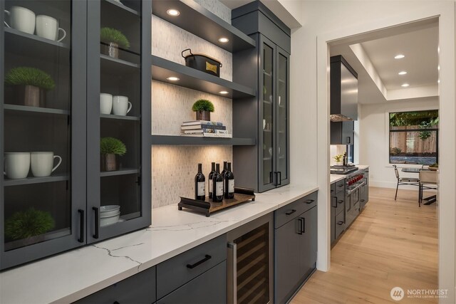 2505 166th Ave SE, Bellevue, WA 98008 - indoor bar featuring wine cooler, tasteful backsplash, light wood-style floors, wall chimney exhaust hood, and recessed lighting