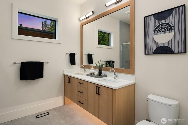 2505 166th Ave SE, Bellevue, WA 98008 - full bath featuring toilet, double vanity, tile patterned floors, a shower with door, and plenty of natural light