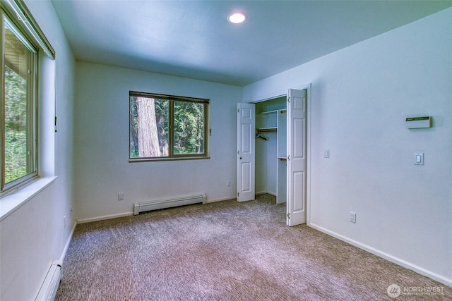 101 Tomihi Dr, Orcas Island, WA 98245 - unfurnished bedroom featuring a baseboard radiator, carpet flooring, a closet, and recessed lighting