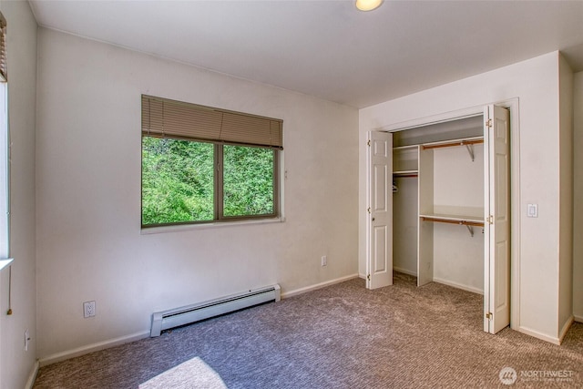 101 Tomihi Dr, Orcas Island, WA 98245 - unfurnished bedroom featuring a baseboard radiator, carpet, a closet, and baseboards