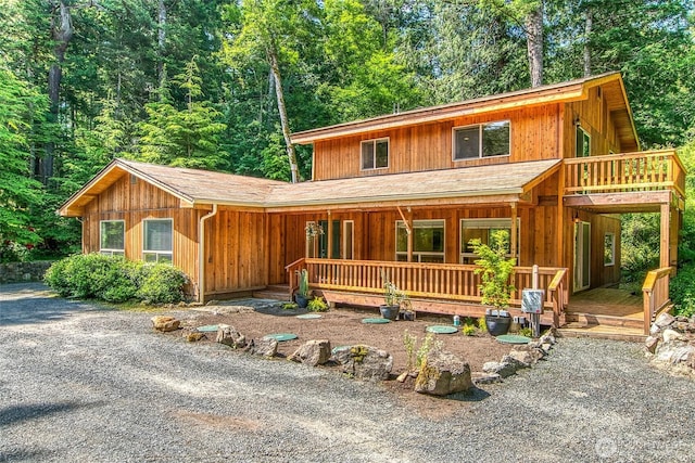 101 Tomihi Dr, Orcas Island, WA 98245 - chalet / cabin with covered porch and a forest view