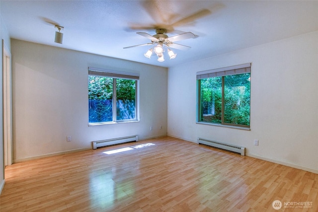 101 Tomihi Dr, Orcas Island, WA 98245 - empty room with a baseboard heating unit, wood finished floors, and ceiling fan