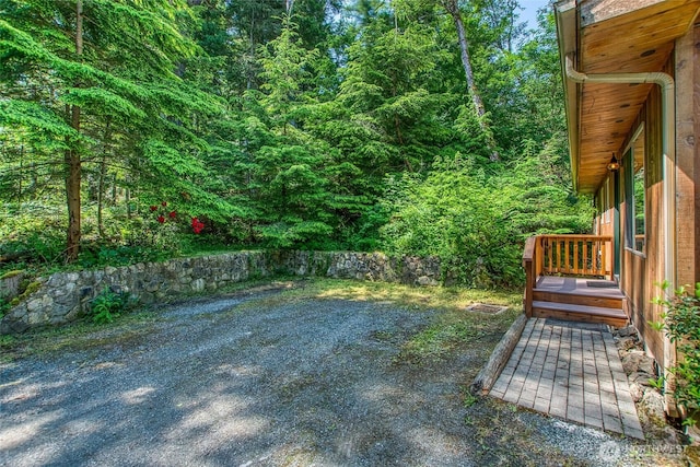 101 Tomihi Dr, Orcas Island, WA 98245 - view of yard featuring a view of trees and a wooden deck