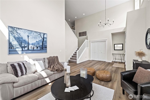 3098 SE 16th St, North Bend, WA 98045 - living room featuring a towering ceiling, stairway, wood finished floors, a chandelier, and recessed lighting