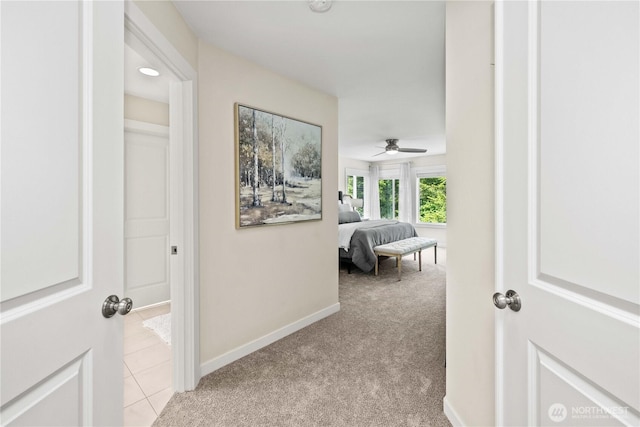 3098 SE 16th St, North Bend, WA 98045 - corridor featuring light carpet, baseboards, and light tile patterned flooring