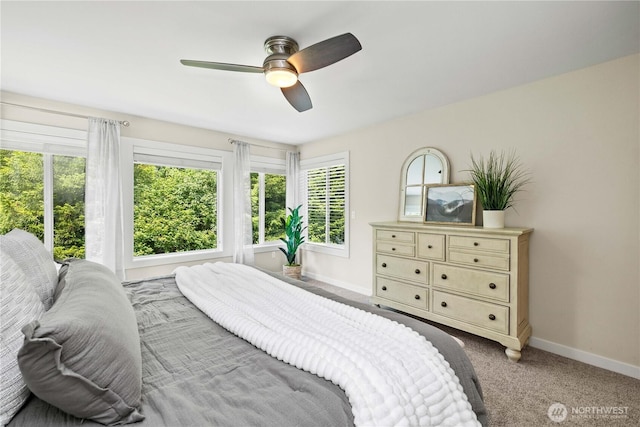 3098 SE 16th St, North Bend, WA 98045 - bedroom with baseboards, multiple windows, light colored carpet, and a ceiling fan