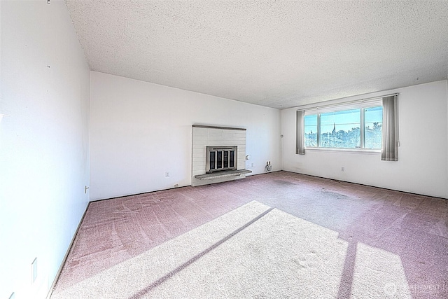 24427 14th Ave S, Des Moines, WA 98198 - unfurnished living room with carpet floors, a textured ceiling, and a brick fireplace