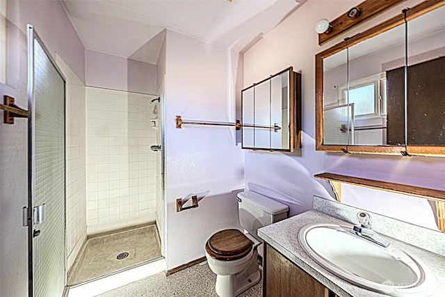 24427 14th Ave S, Des Moines, WA 98198 - bathroom featuring toilet, a stall shower, baseboards, and vanity