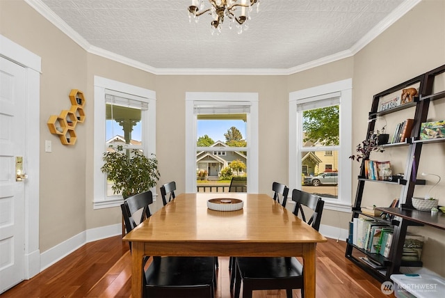 2321 Elm St, Bellingham, WA 98225 - dining area with wood finished floors, a chandelier, baseboards, and crown molding