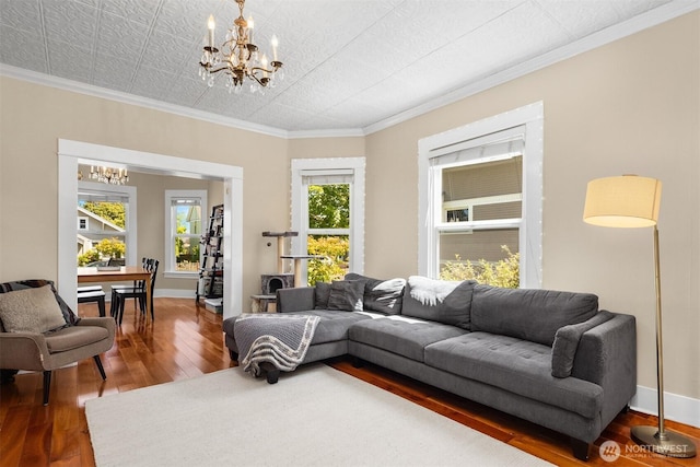 2321 Elm St, Bellingham, WA 98225 - living area with a chandelier, wood finished floors, plenty of natural light, crown molding, and baseboards