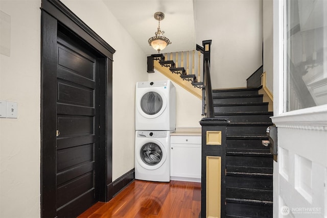 2321 Elm St, Bellingham, WA 98225 - laundry room featuring estacked washer and dryer, dark wood-style floors, and baseboards