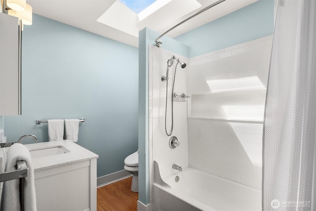 2321 Elm St, Bellingham, WA 98225 - bathroom with toilet, shower / bath combination with curtain, wood finished floors, vanity, and a skylight