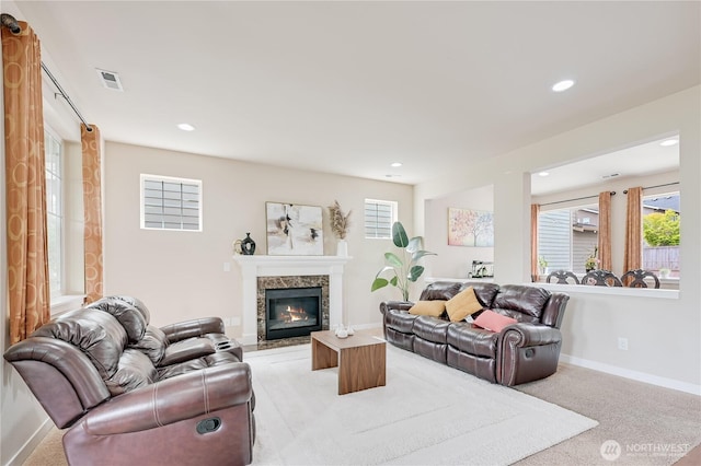10821 Eastridge Dr NE, Redmond, WA 98053 - living area with recessed lighting, a high end fireplace, baseboards, and light carpet